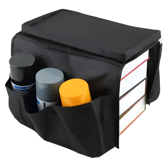 Sofa armrest organizer bag in dark fabric with multiple front pockets and top storage