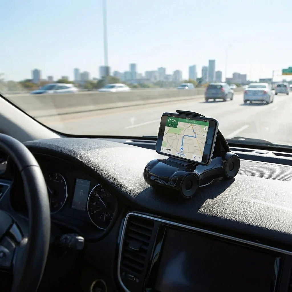 Black sports car shaped mobile phone stand mounted on dashboard with GPS phone