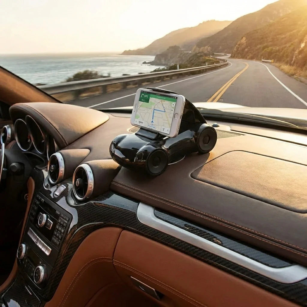 Black sports car shaped mobile phone stand with smartphone mounted in car interior