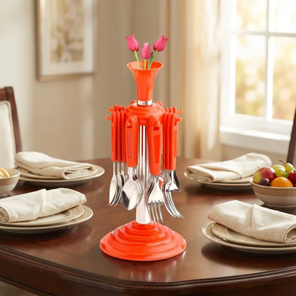 Stainless cutlery set with an orange base, metal forks and spoons, standing as a centerpiece bundle.