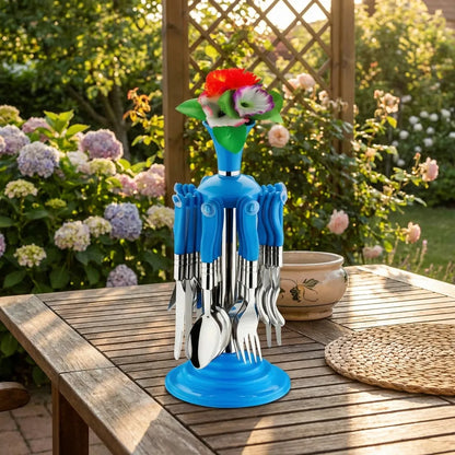 Stainless cutlery set in a blue base with metal forks and spoons, topped with a small vase.
