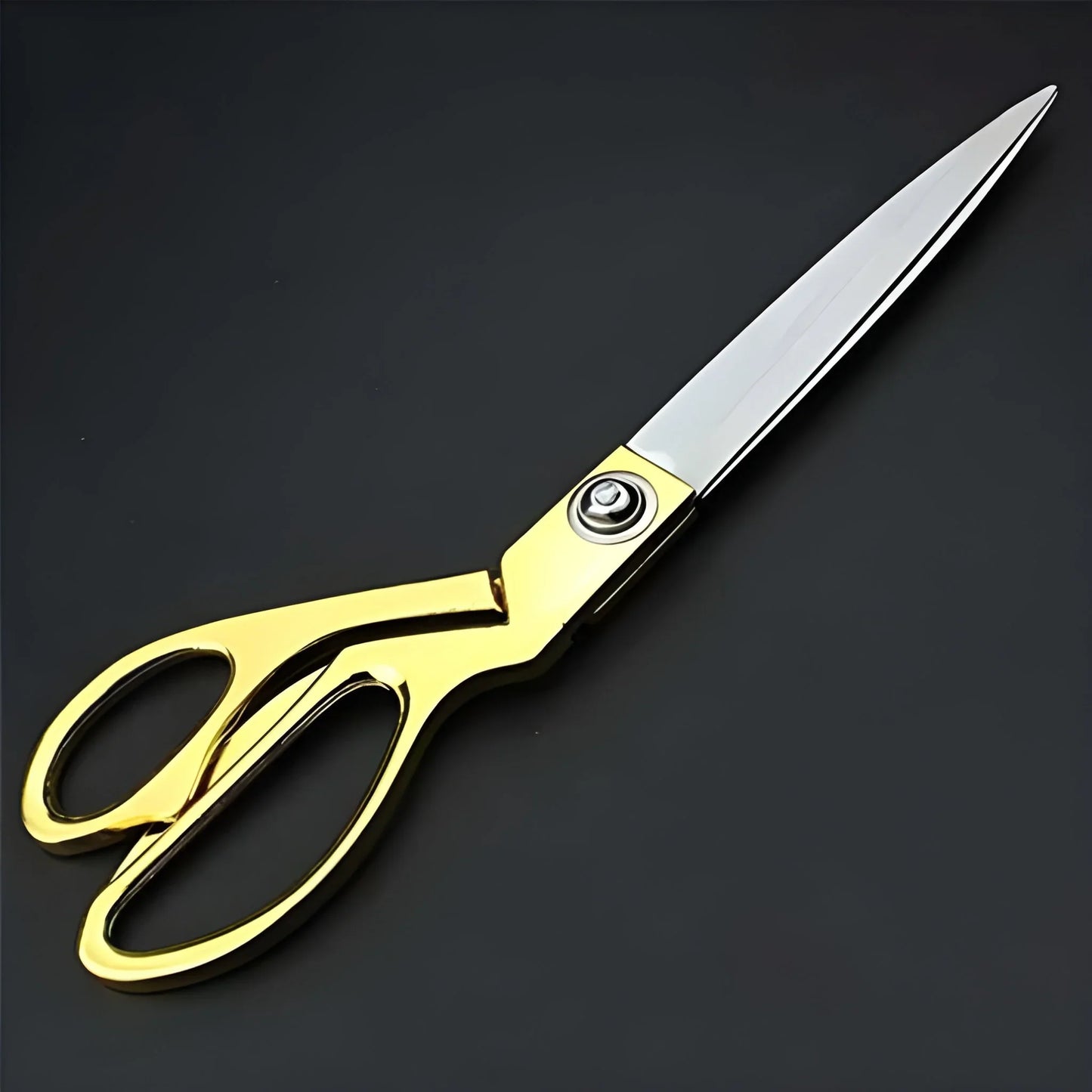 Tailoring scissors with gold handle and stainless steel blades
