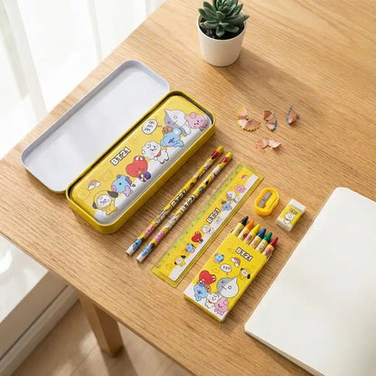 Kids stationery set with open yellow BT21 pencil case, colored pencils, and eraser