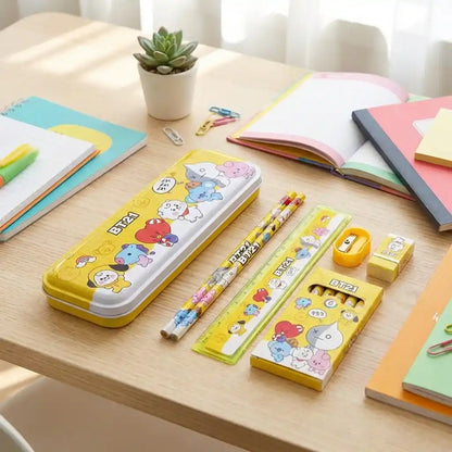 Kids BT21 stationery kit on desk: yellow pencil case, pencils, eraser, and pencil pack