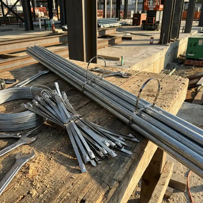 Bulk steel cable ties on wooden pallets, silver bands bundled for transport