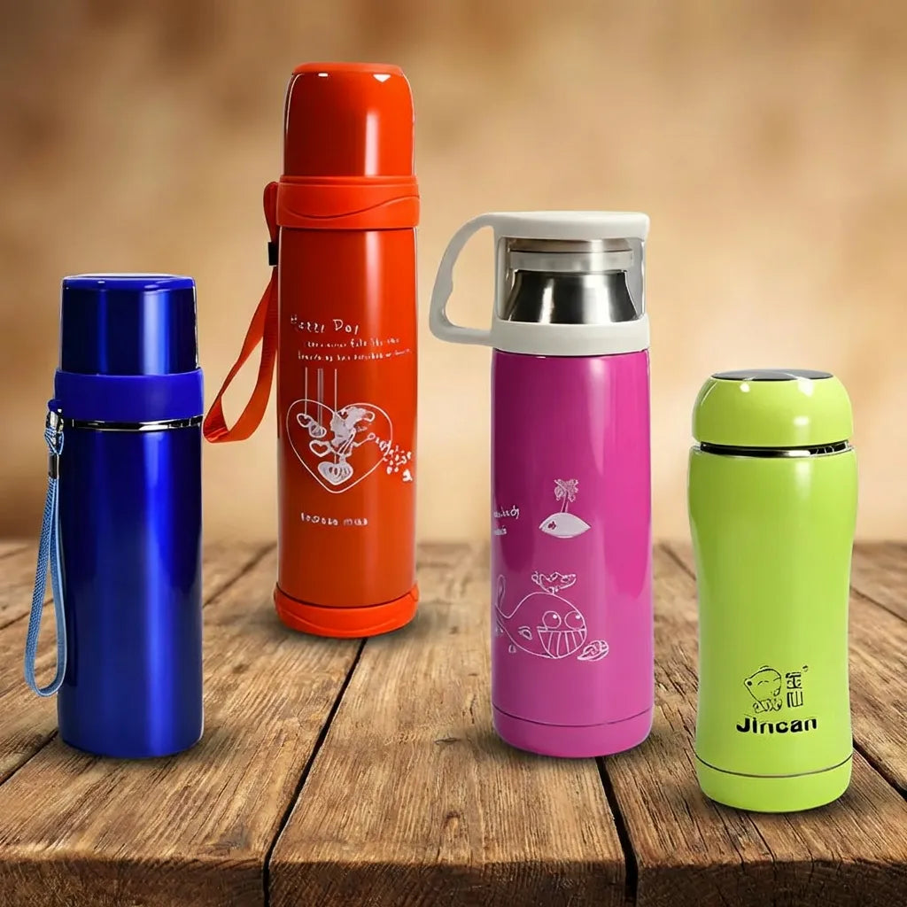 Steel insulated water bottles in blue, orange, pink, green with white caps on wooden surface