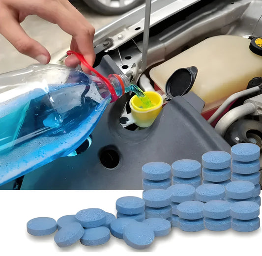 Blue windshield cleaner tablets in a small pile, round tablet shapes