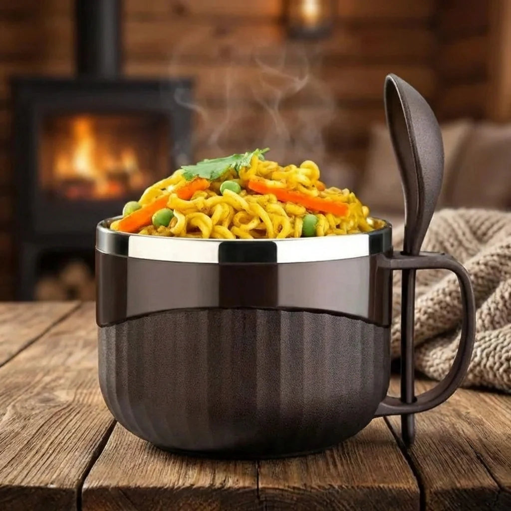 Dark lunch bowl with lid and handle, filled with noodles and vegetables