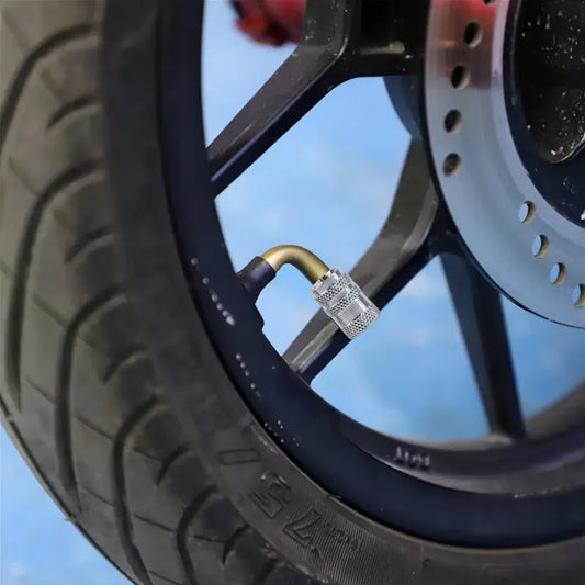 Metallic tire valve stem cap with textured grip