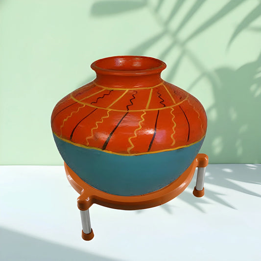 Terracotta and teal pot-shaped universal hot pad with three legs and side handle