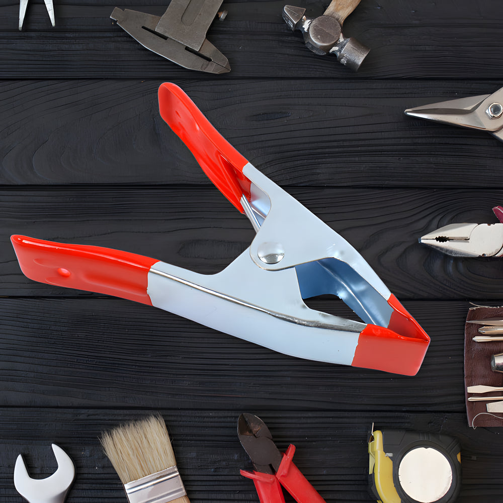 Red and silver grip clamp tool with adjustable jaw and trigger lever
