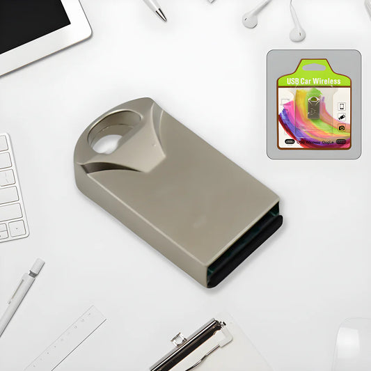 Metallic USB Bluetooth adapter with rectangular body and USB plug, top view