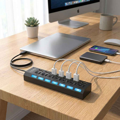 USB multi hub showing blue LED indicator bar and connected white cables