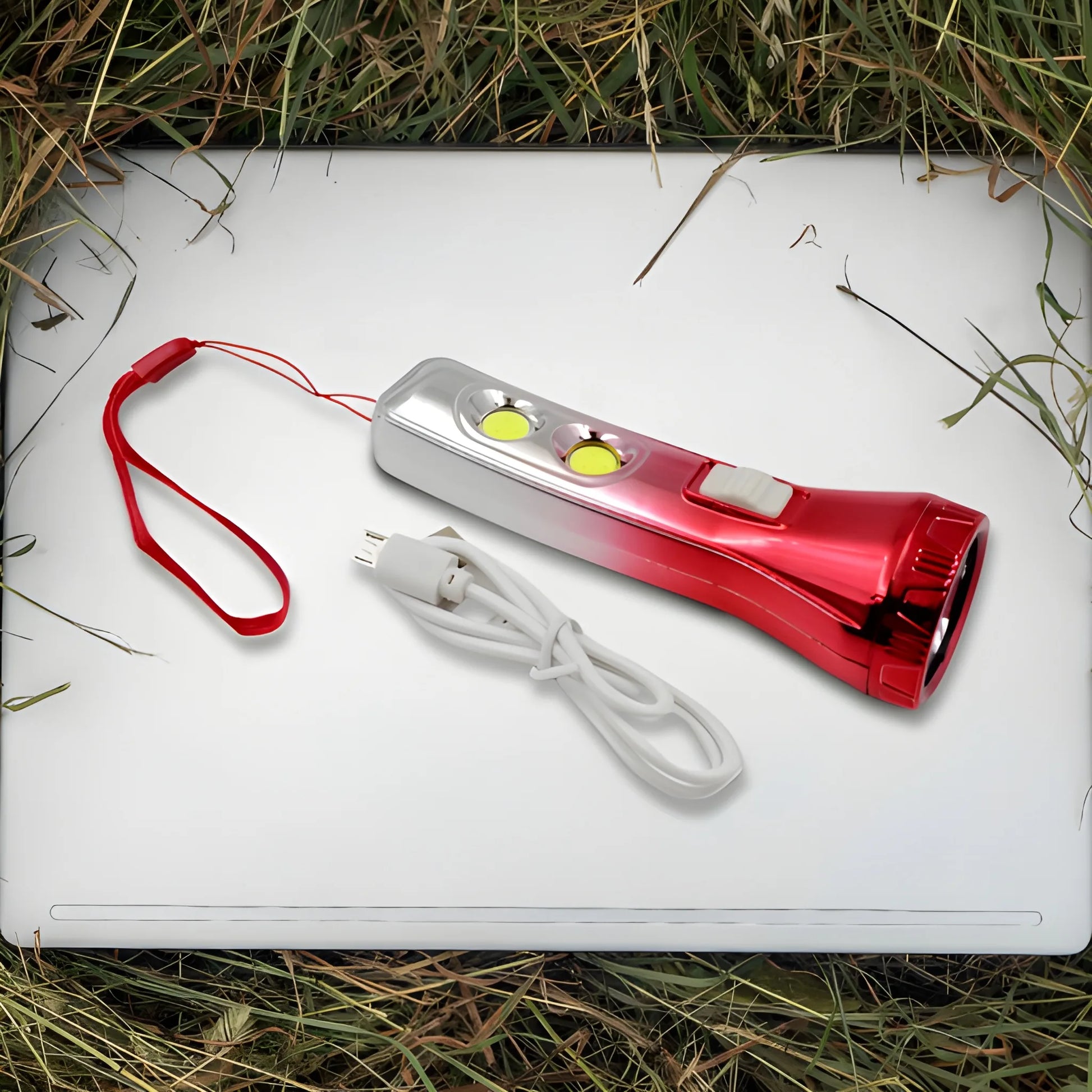 Rechargeable emergency flashlight with red and gray body, lanyard and USB cable