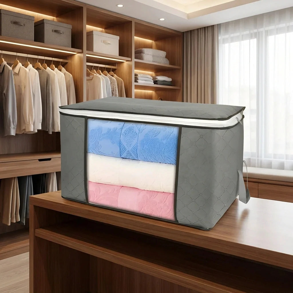 Vacuum compression storage bag, gray with clear window showing folded clothes