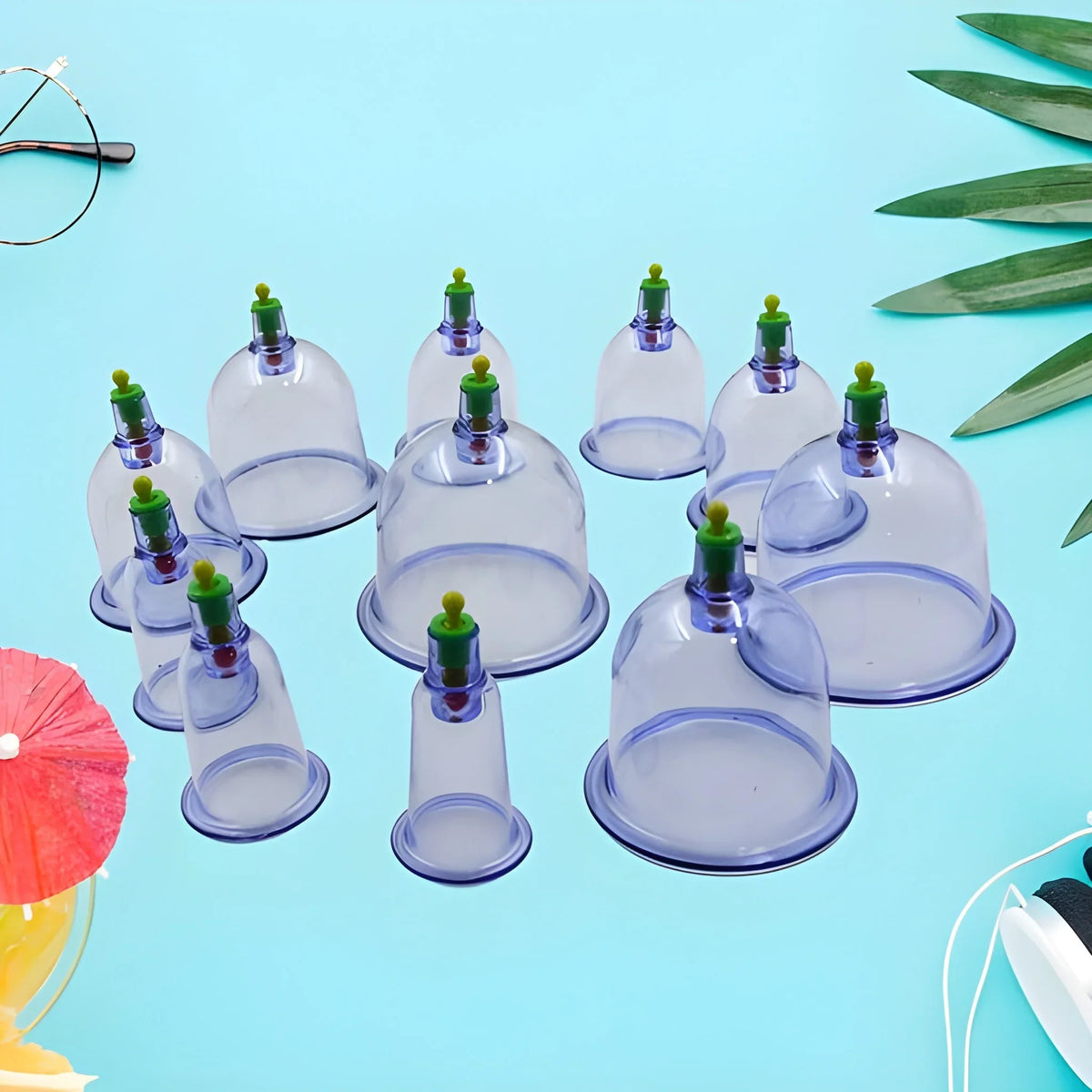 Vacuum cupping set with six clear cups and green valves