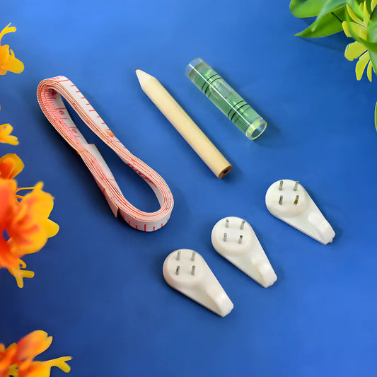 Wall hanging tool kit with white hooks, cords, and green measuring tape