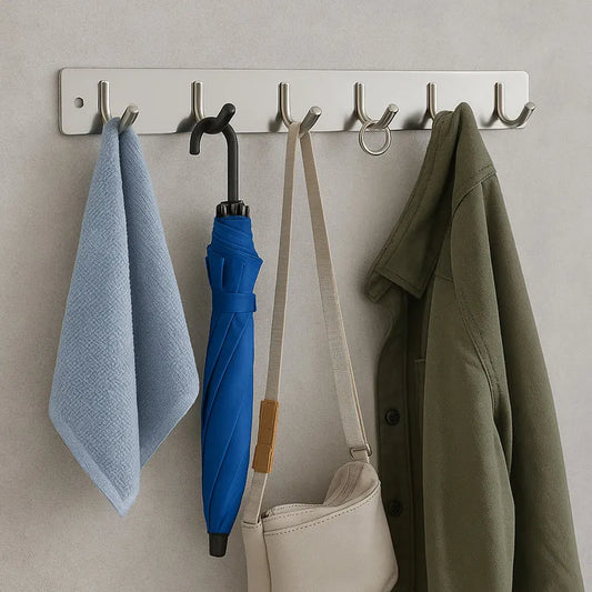 Wall-mounted coat rack with 6 metal hooks and a brushed bar, holding coats