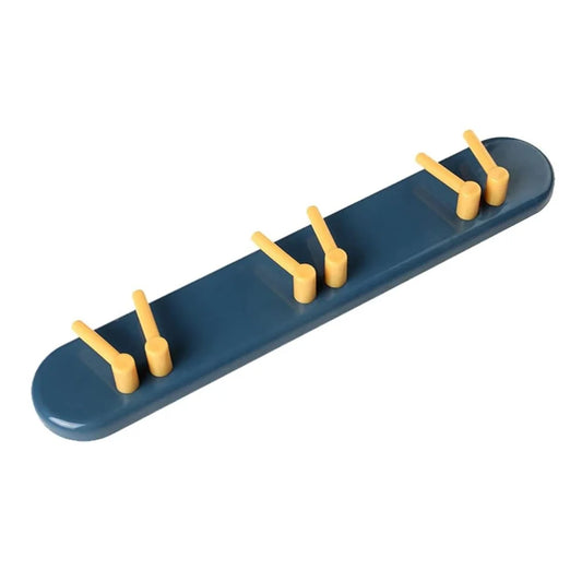 Wall-mounted toothbrush holder with dark blue base and three yellow slots