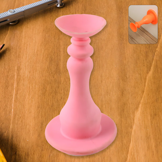 Pink silicone door stopper with flared base and narrow stem