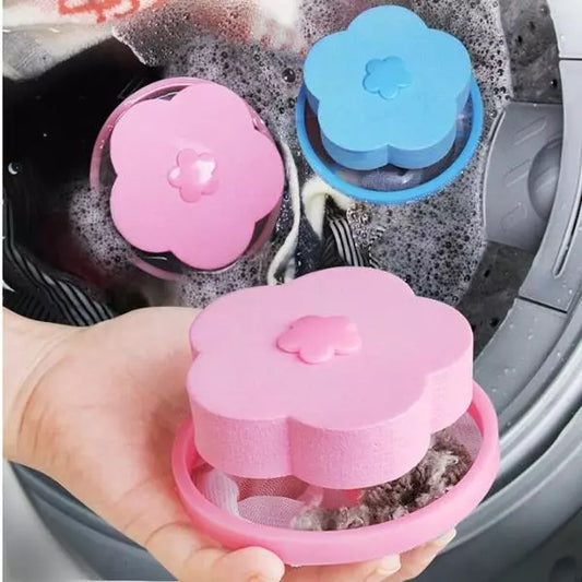 Pink flower-shaped lint catcher for washing machine, held in hand with filter base