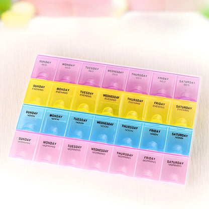 Weekly pill organizer box with 7-day compartments labeled Sunday to Saturday