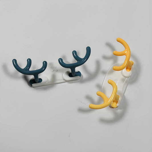 Adhesive hook set with teal and orange curved hooks on a white backing