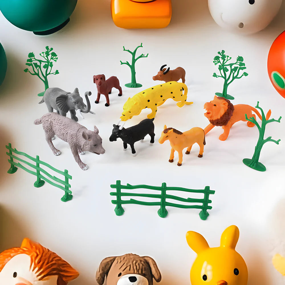 Wild animal toy set featuring multiple animal figures with green fence and tree pieces