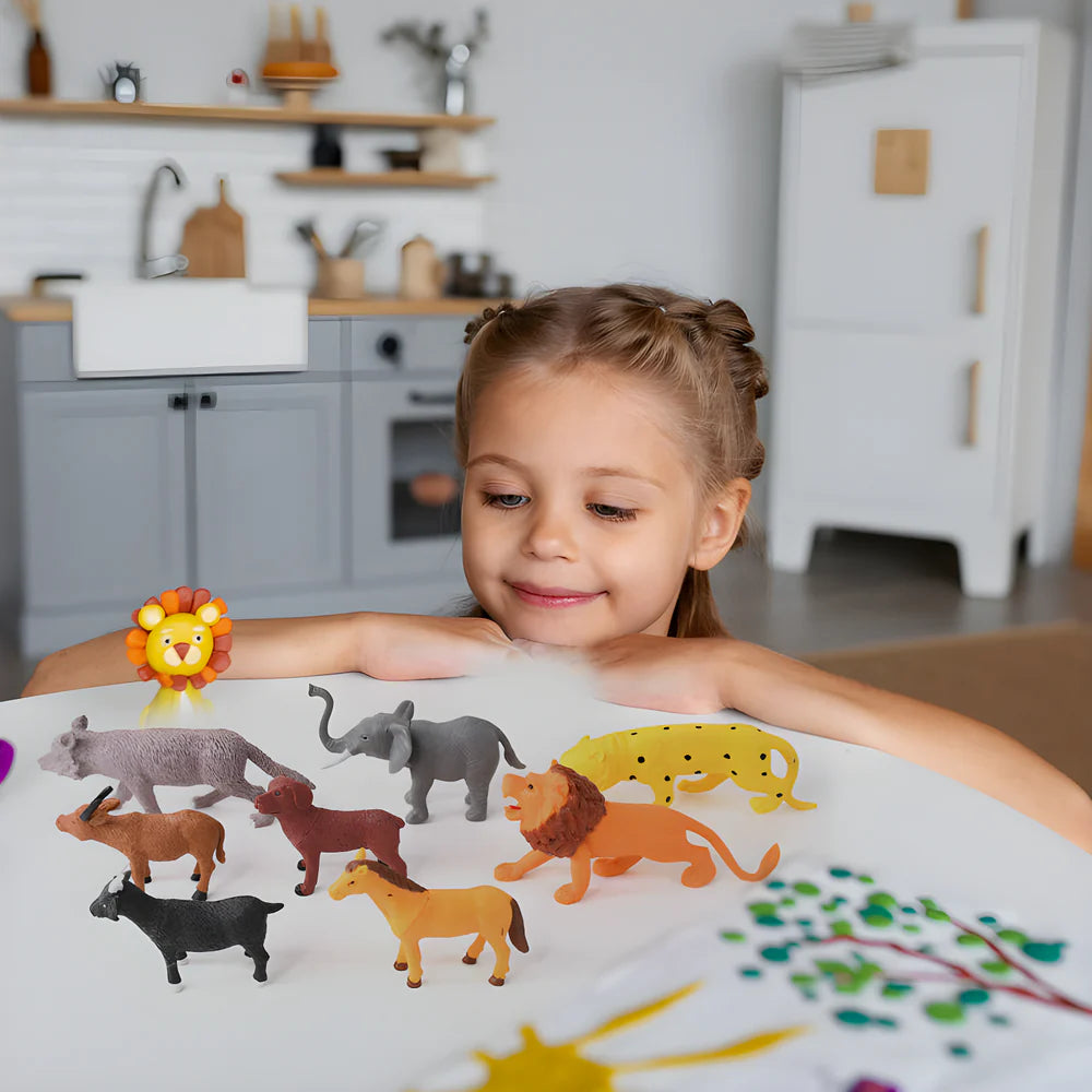 Wild animal toy set with animal figures on a tabletop while a child plays