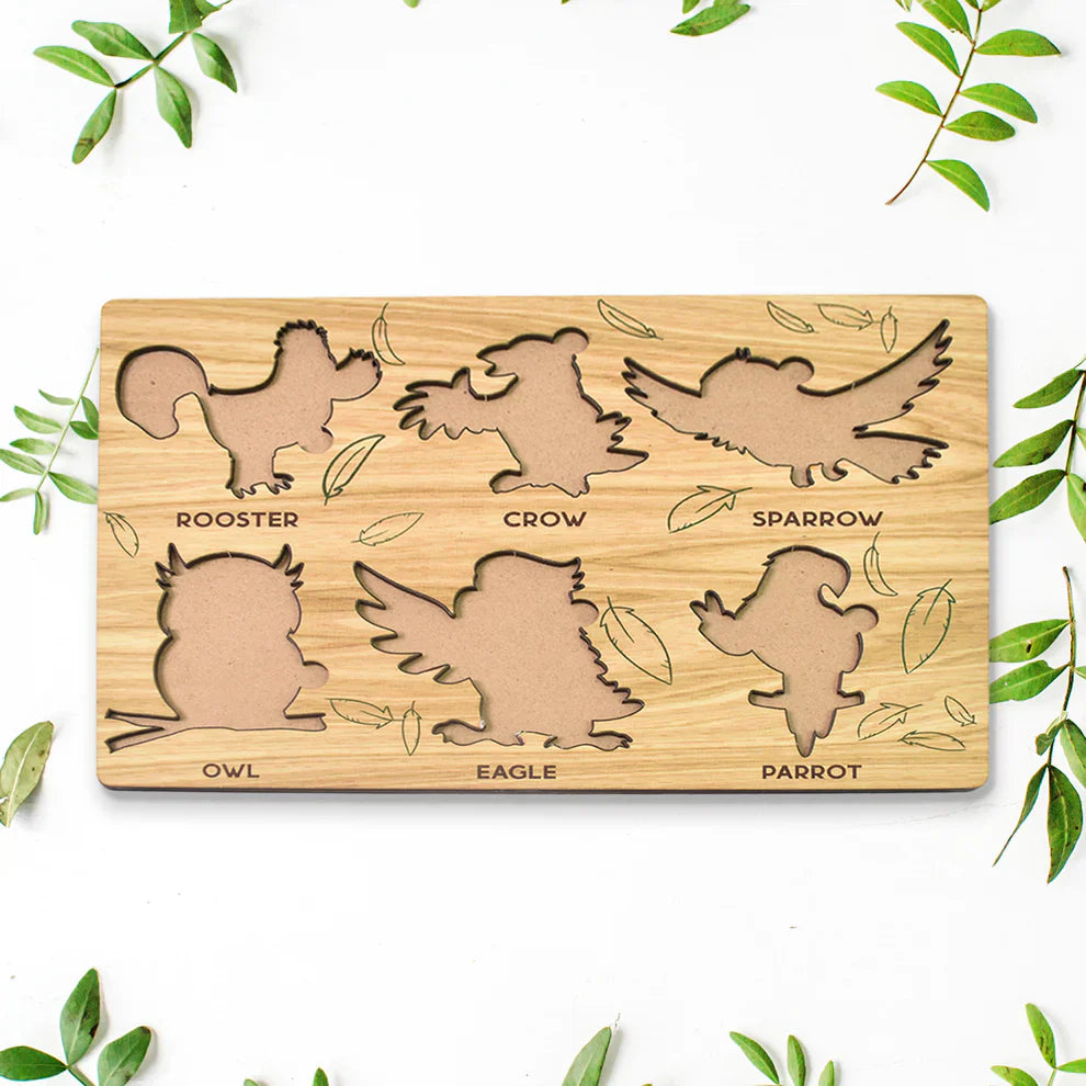 Wooden bird-shaped puzzle learning board with eight animal silhouettes and printed names
