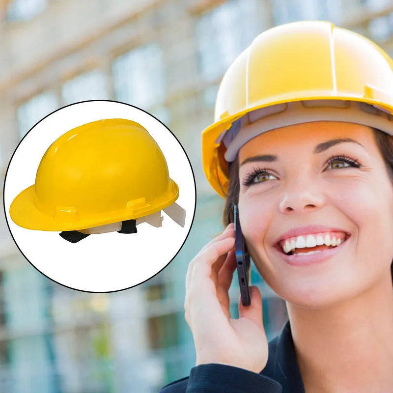 Yellow plastic construction hard hat with white chin strap